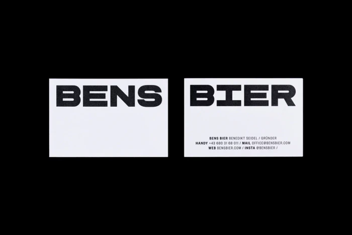 Two white business cards displaying bold black typography for Bens Bier against a solid black background.