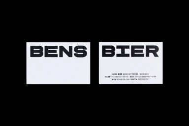 Two white business cards displaying bold black typography for Bens Bier against a solid black background.