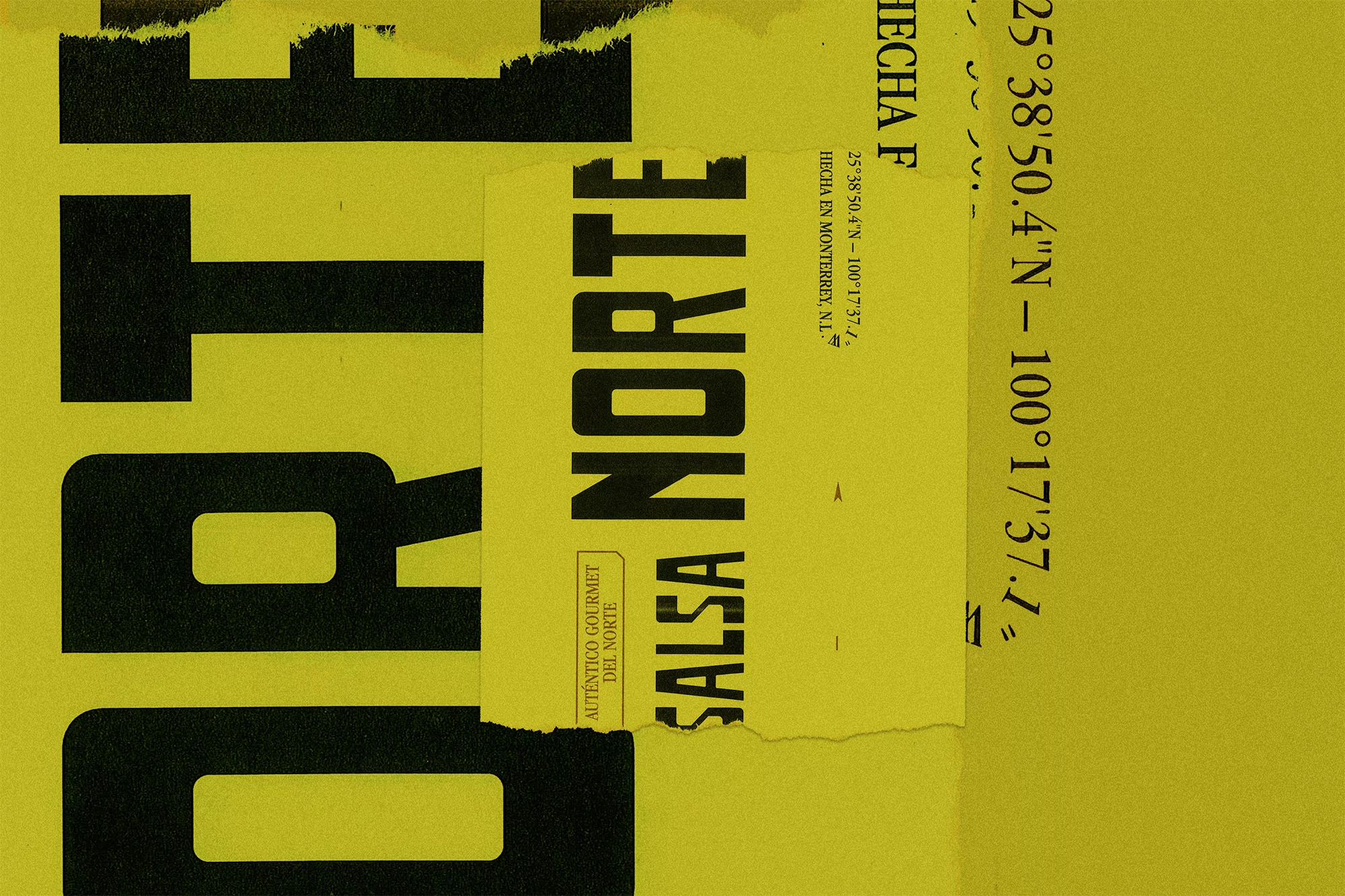Close-up of a yellow background featuring black, block-letter text. The text reads 'Salsa Norte', with additional coordinate information.