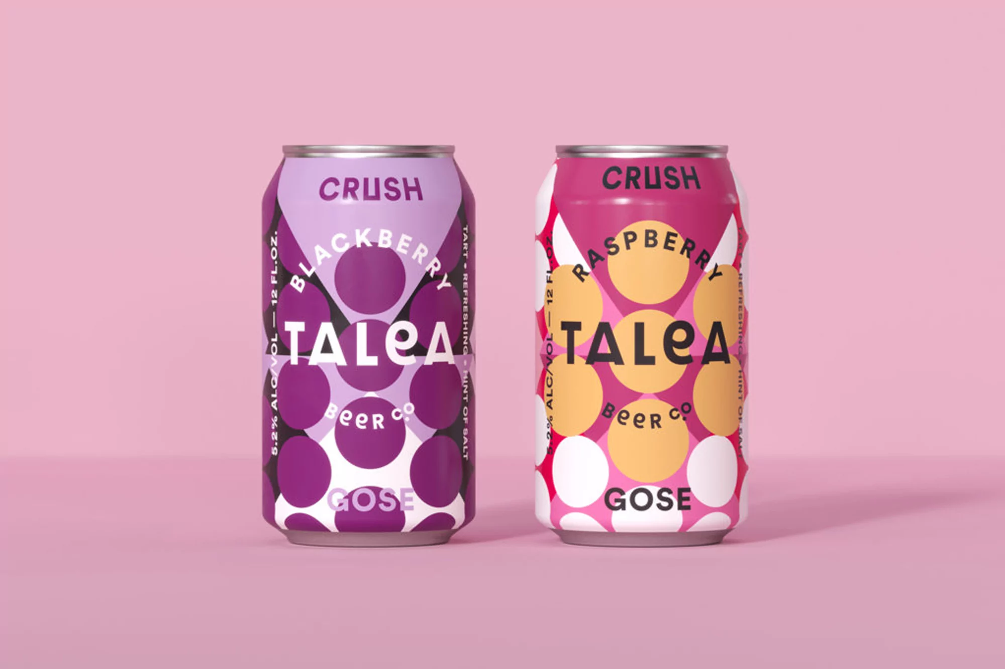 Two colorful cans of Talea Crush Blackberry and Raspberry Gose craft beer, photographed in a studio on a light pink background.