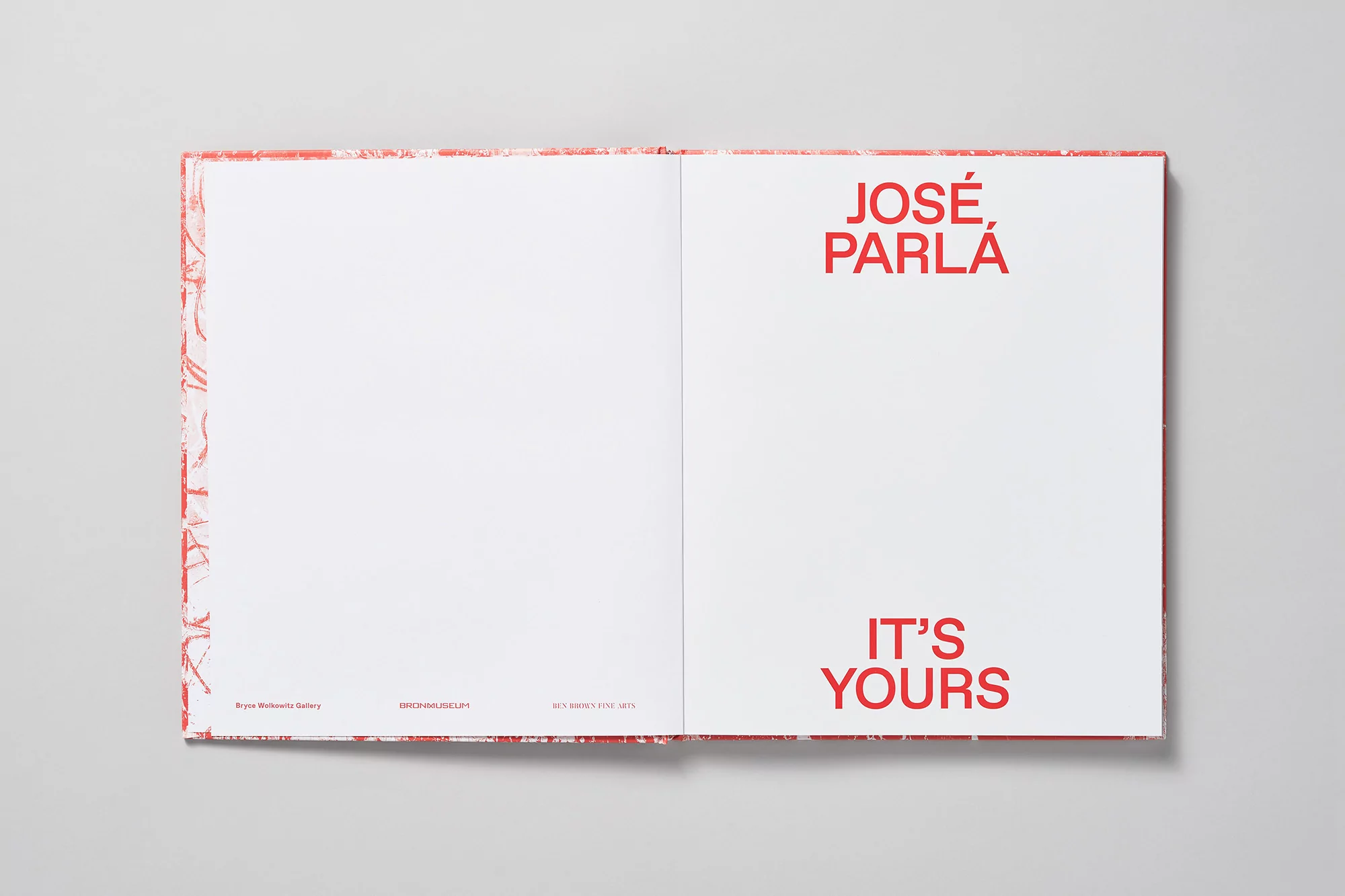 Open book displaying red text "JOSÉ, PARLÁ" and "IT'S YOURS" on a white page, with graphic red accents on the cover.