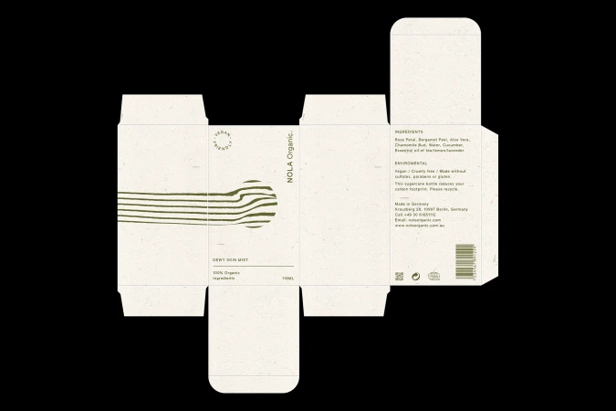 Unfolded beige and green packaging design with ingredients and brand details for NOLA Organic Dewy Skin Mist, shot in photo studio.