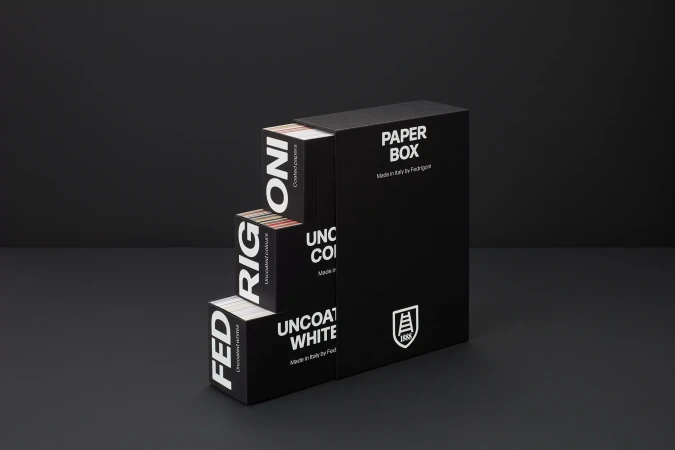 A black tiered paper box set with white typography on a dark surface, created for Fedrigoni by Graphic Thought Facility.