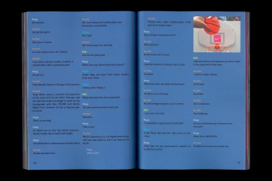 Open book spread showing blue pages with interview text in multiple colours and a photograph of a mini basketball hoop