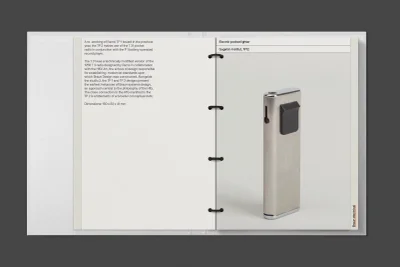 An open ring binder displaying descriptive text on the left page and a metallic electric pocket lighter on the right page.