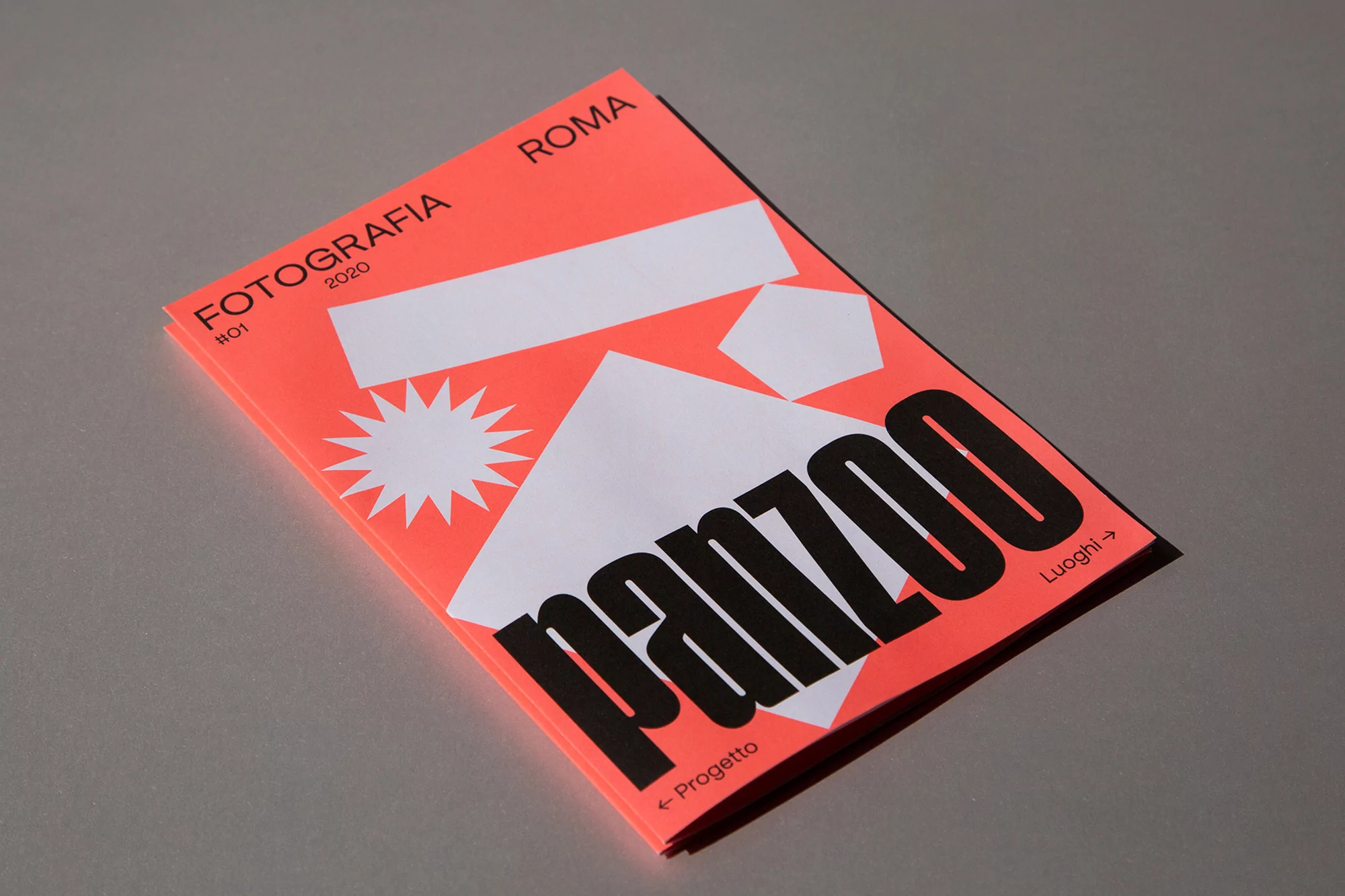 Minimalist photography magazine cover featuring bold typography, geometric shapes, and a vibrant orange background, ideal for design inspiration.