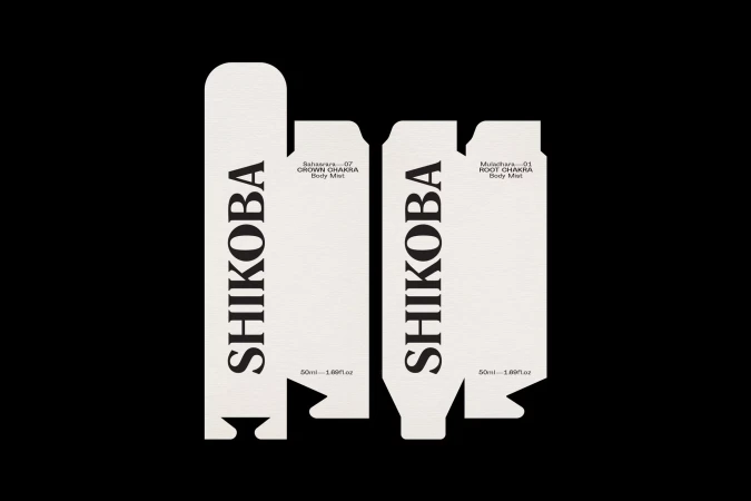 Two Shikoba brand body mist boxes in white and black with text on a black background, showcasing minimalist design.