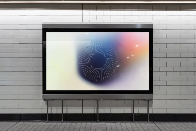 Abstract, blurry multicolor graphic with black circular line design on a large advertising billboard in a subway station with white tiles.
