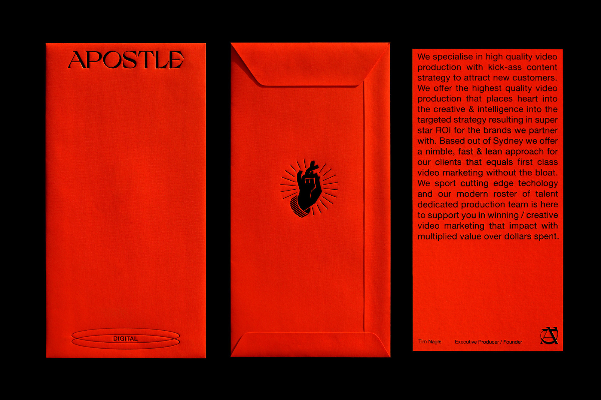 Bright red marketing display featuring the word APOSTLE, a hand graphic with sun rays, and promotional text for digital video production.