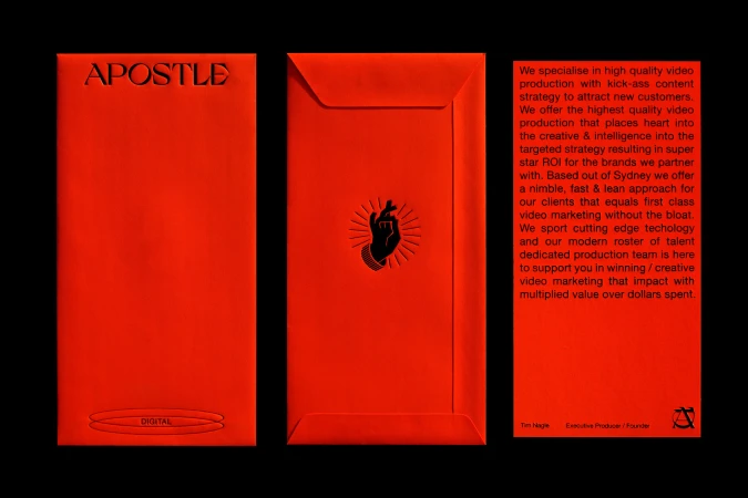 Bright red marketing display featuring the word APOSTLE, a hand graphic with sun rays, and promotional text for digital video production.