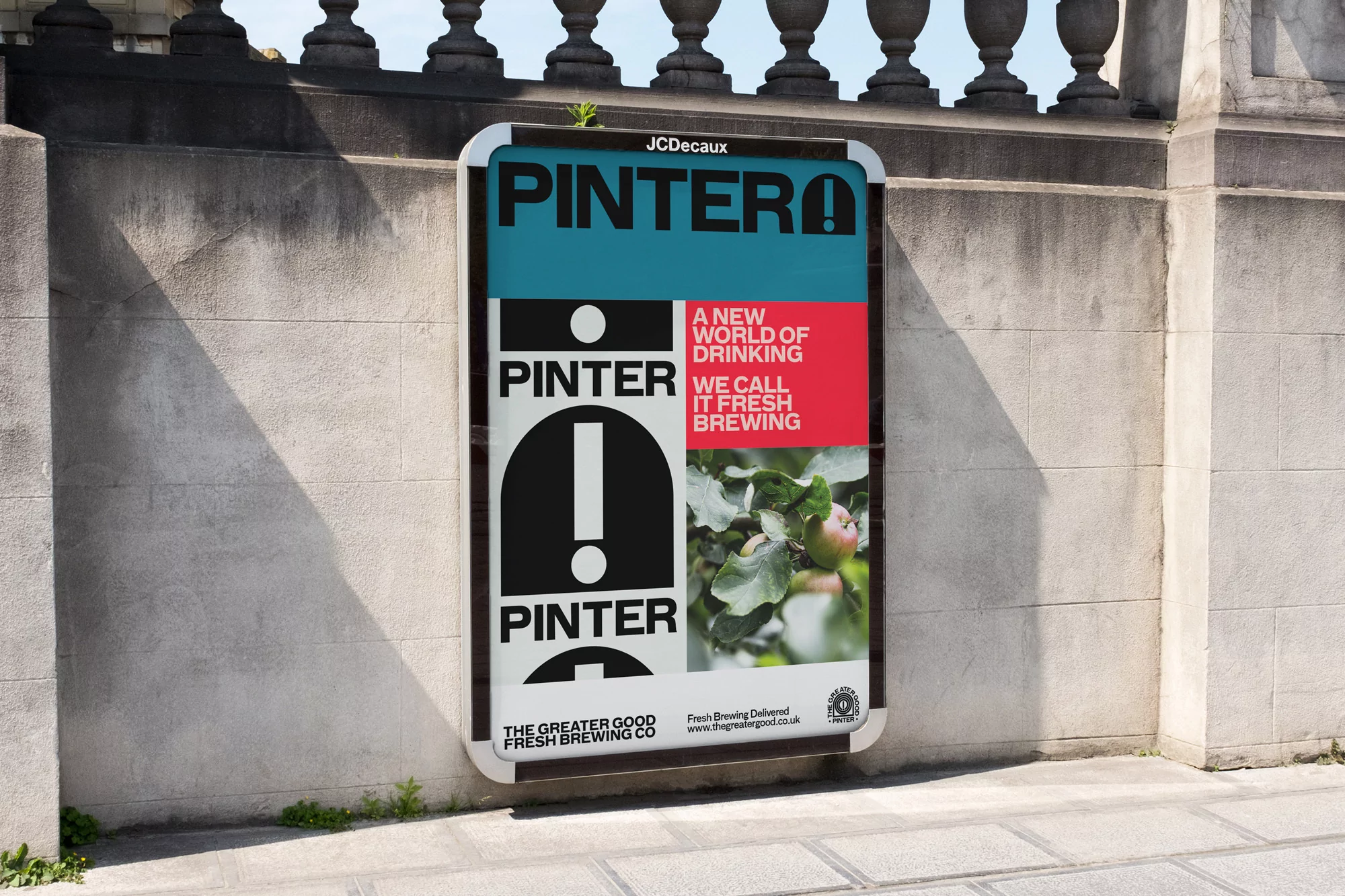 Outdoor advertising billboard poster for PINTERO, featuring teal, black, white, and red design, plus photo of apples on tree branch.