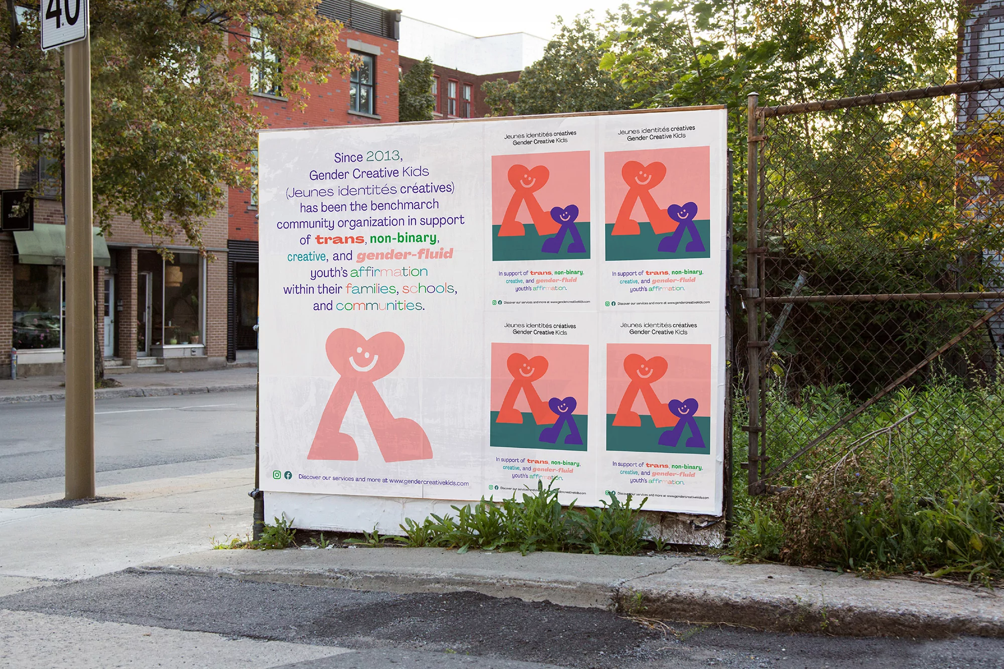 Outdoor advertising featuring a Gender Creative Kids poster on a city street, promoting inclusivity for trans and gender-fluid youth.