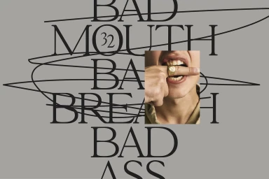 Graphic poster design featuring large serif typography and a photographic insert of a person biting a finger with a gold ring.