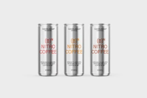 Three silver nitro coffee cans standing upright on a seamless white studio background with distinct flavoured typography.