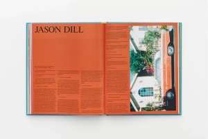 Open book spread showing biographical text layout on the left and an exterior car photo on the right.