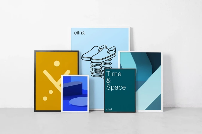 Several framed art prints are displayed against a white wall featuring a variety of color palettes, geometric shapes and minimal designs.