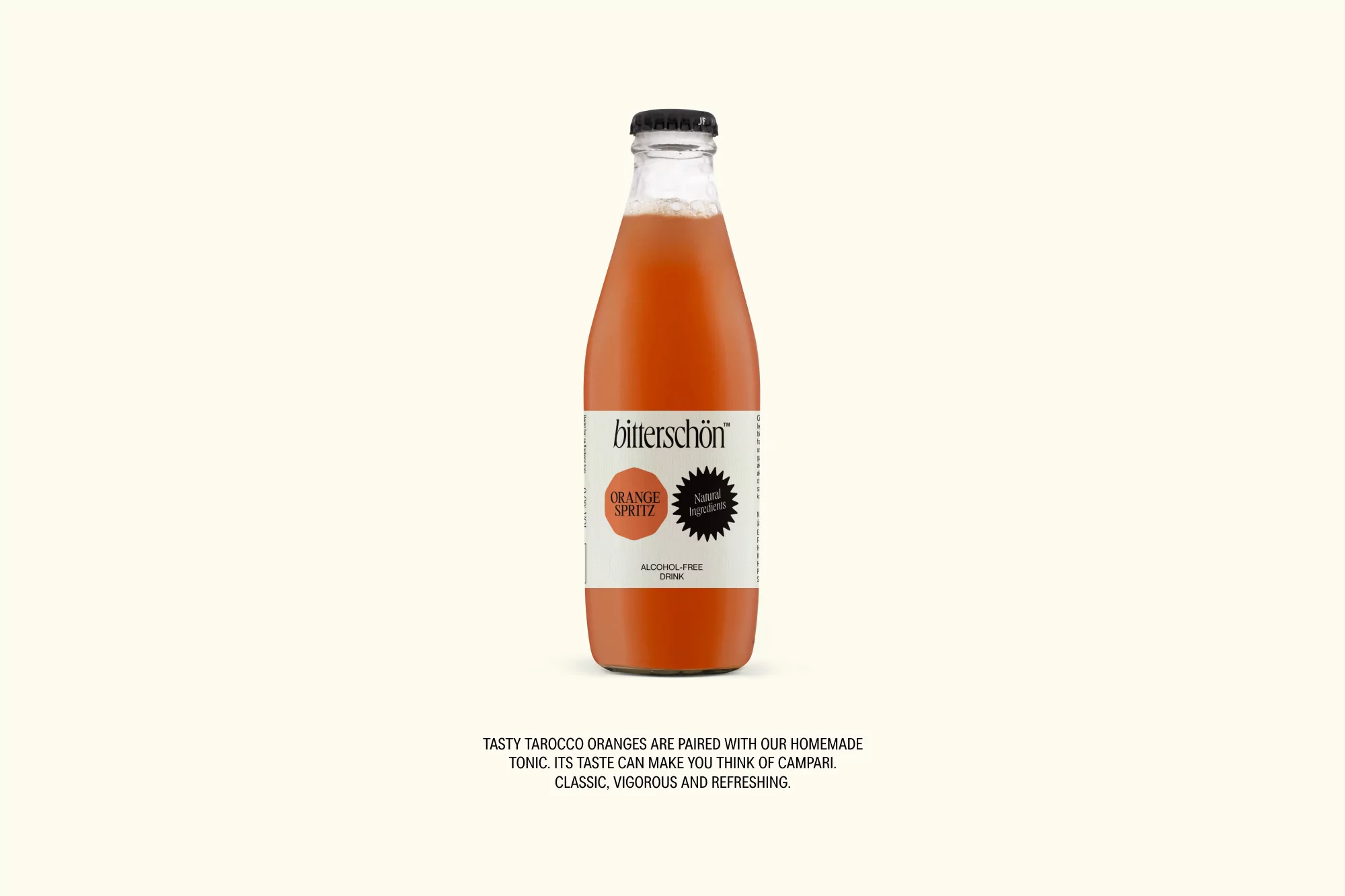 A bottle of orange spritz drink with a black cap and clear label on a light beige background. Refreshing non-alcoholic drink.