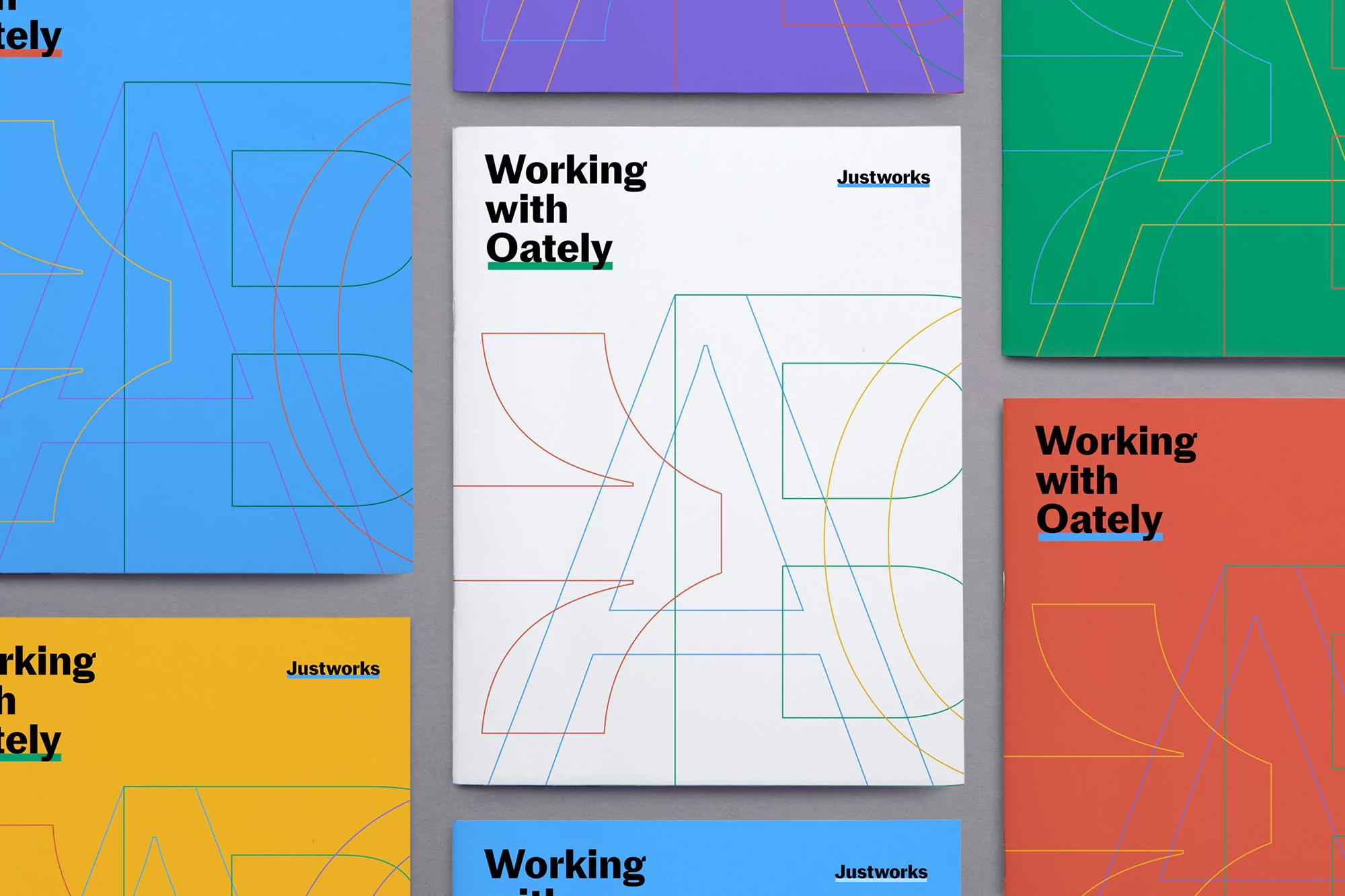 Collection of modern, graphic design book covers featuring geometric shapes and bold typography, presented on a neutral surface.