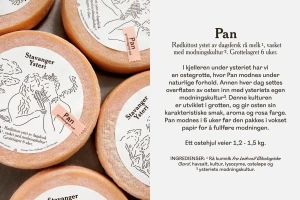 Round wheels of cheese with illustrated paper labels alongside descriptive Norwegian text for Stavanger Ysteri brand identity