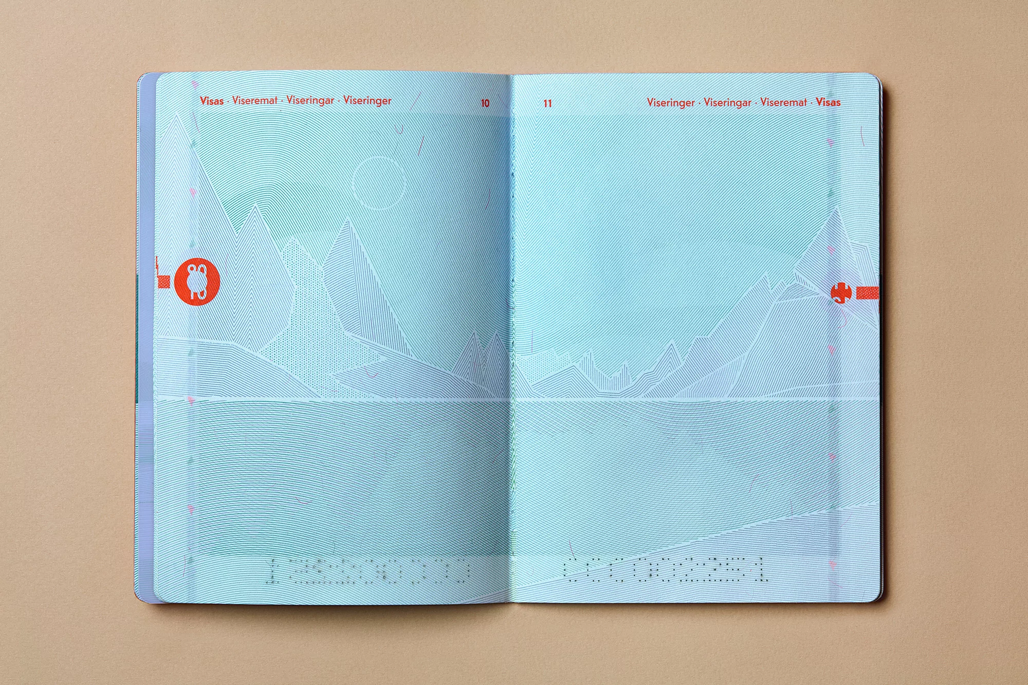 Open passport displaying blank visa pages with light blue background and faint mountain range design, ready for immigration stamps.