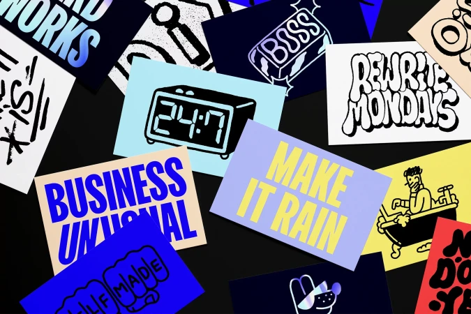 Graphic designs with typography and illustrations, including an alarm clock, fist, and cartoon figure in a bathtub, spread on a black surface.