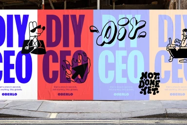 Colorful billboard featuring bold typography and playful character illustrations for Oberlo brand identity