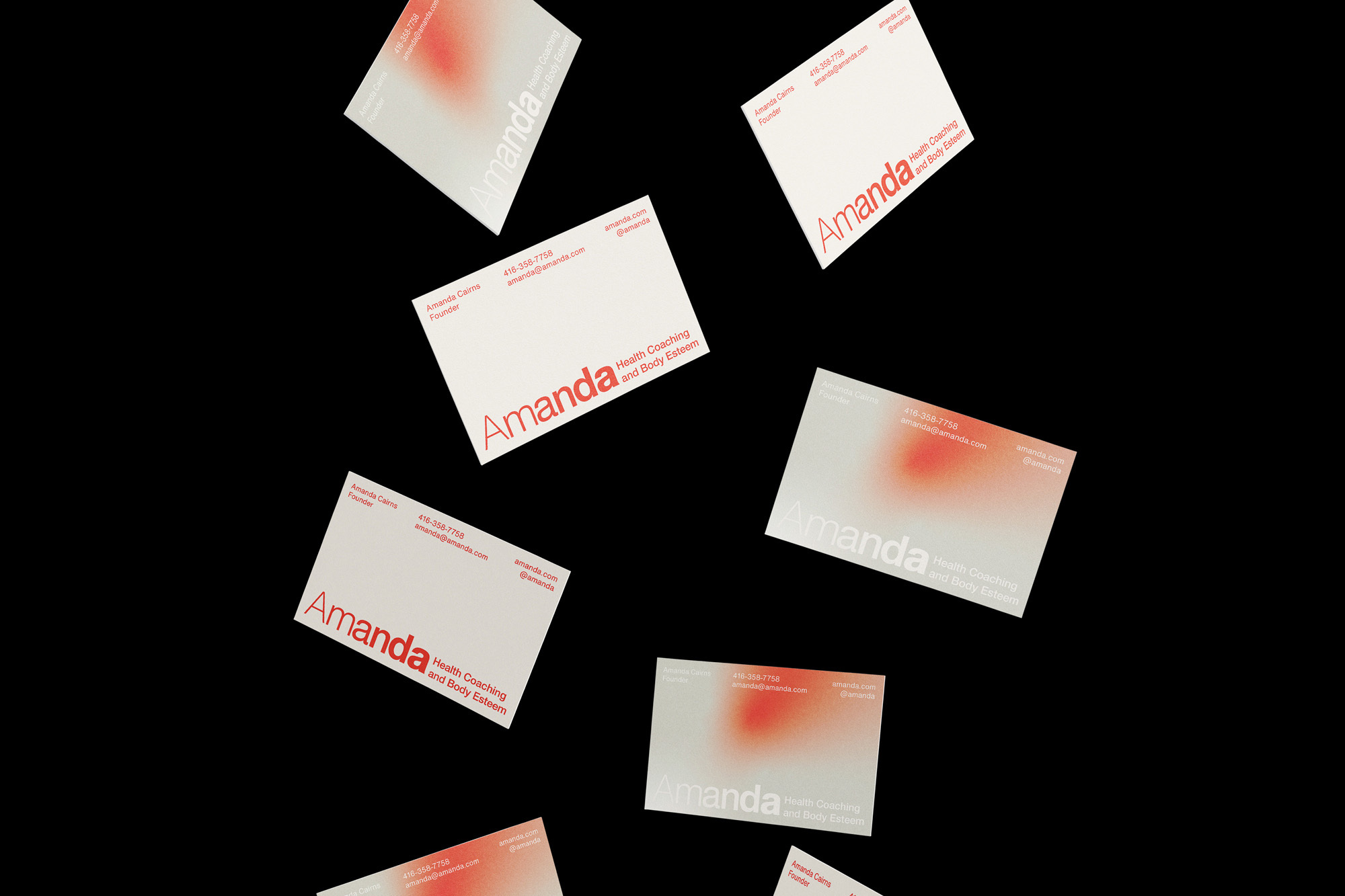 Multiple minimalist business cards with a red gradient and 'Amanda' text arranged on a black background in a modern, clean design.