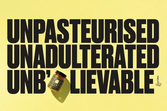 Product shot of jar with 'BEES' text label on yellow background with bold text 'UNPASTEURISED UNADULTERATED UNB'LIEVABLE'.
