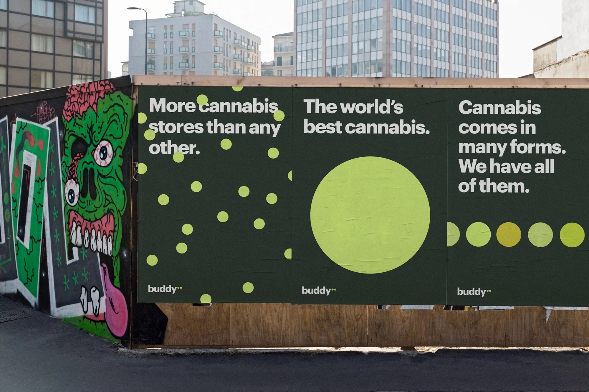 Billboard advertisement featuring cannabis messaging and colorful graffiti in an urban environment with buildings in the background.