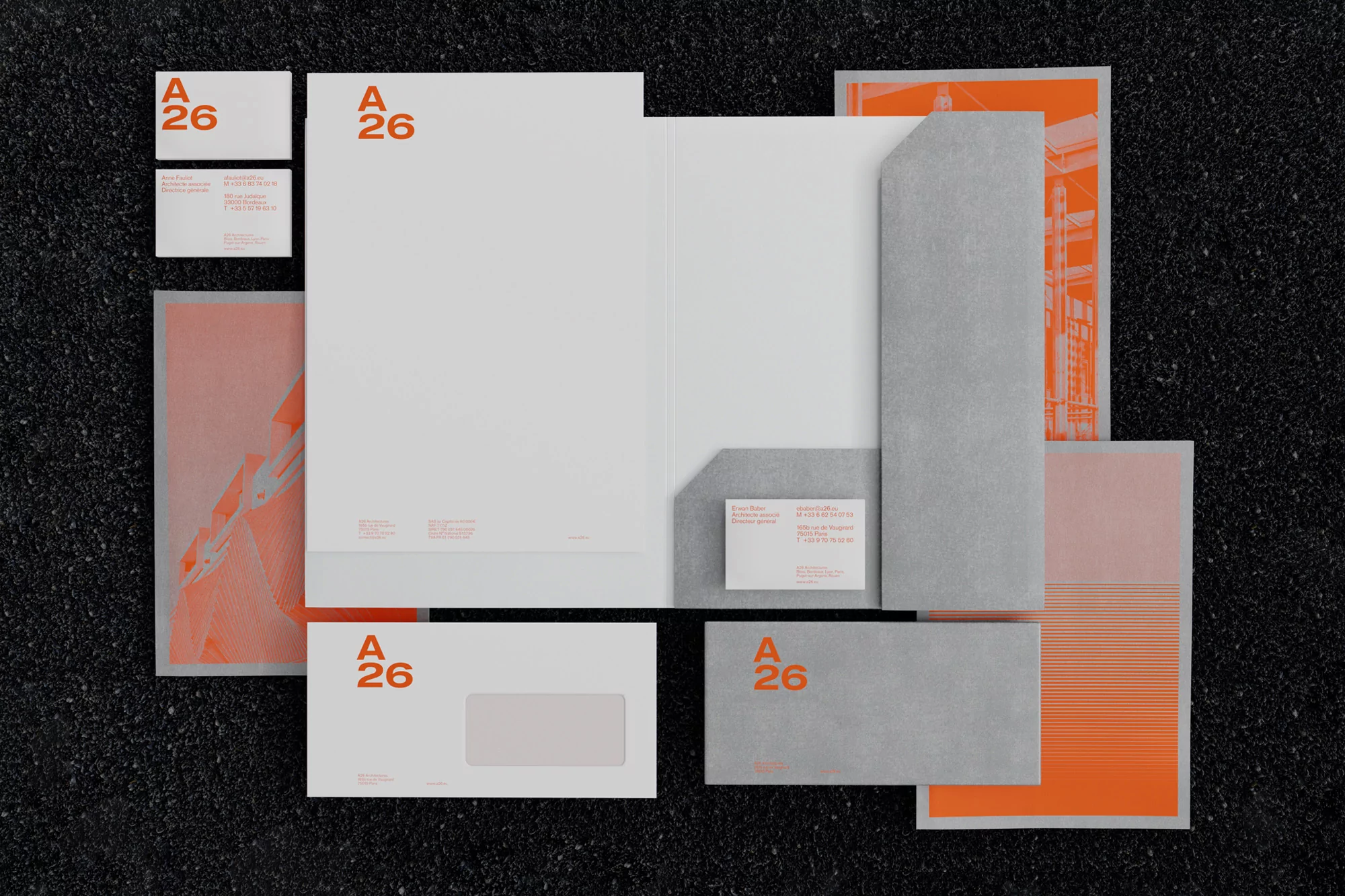 Elegant business stationery set featuring letterhead, business cards, folder, and envelope in white, gray, and orange color scheme.
