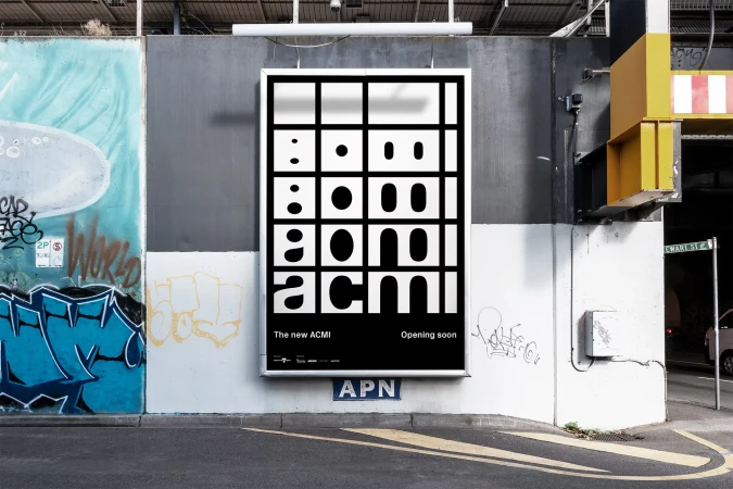 Outdoor shot of an ACMI advertisement poster on a concrete wall with graffiti in an urban setting, promoting the Australian Centre for the Moving Image.