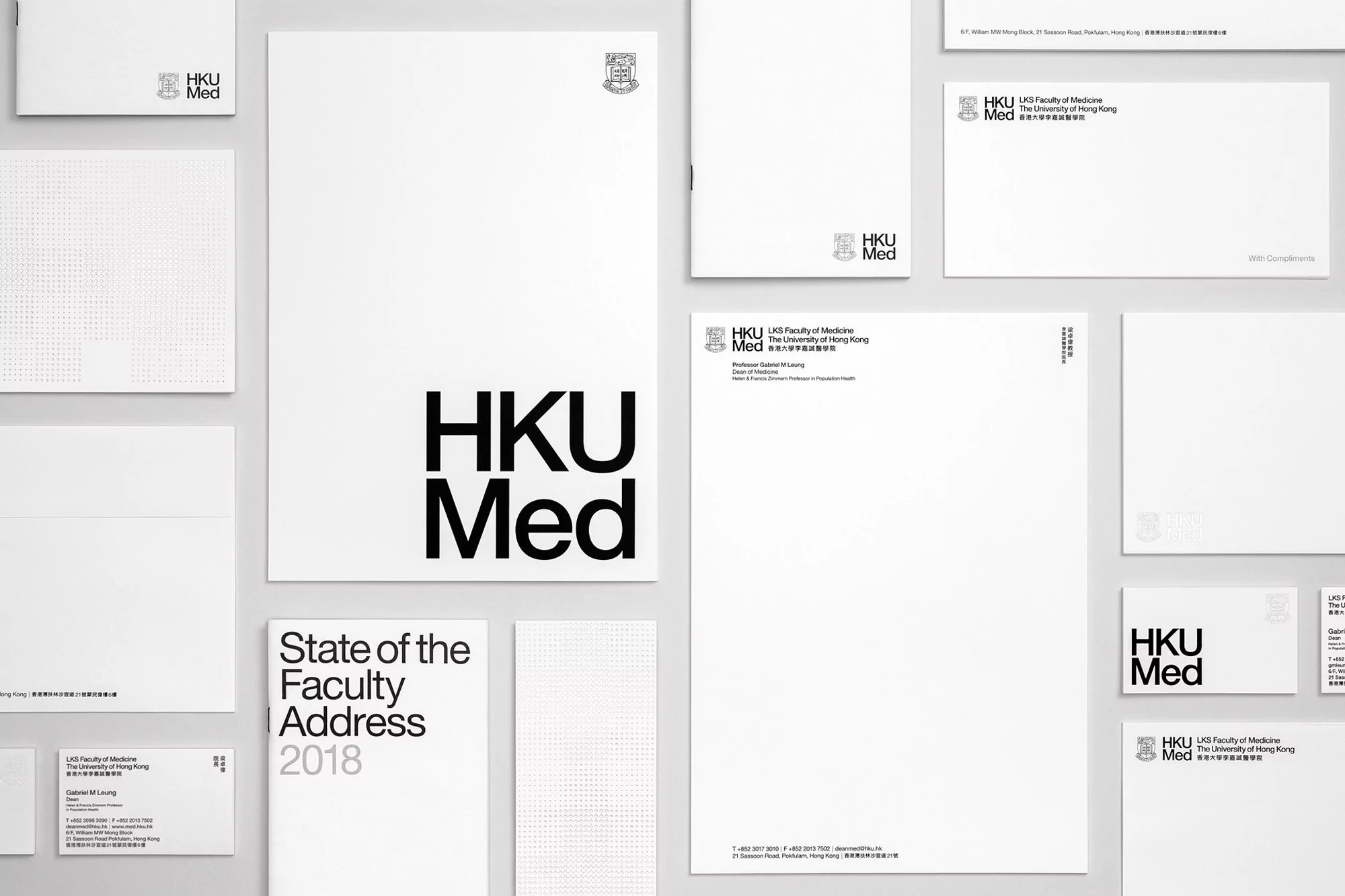HKU Med branded stationery with letterheads, envelopes, and business cards in a flat lay composition on a white background.