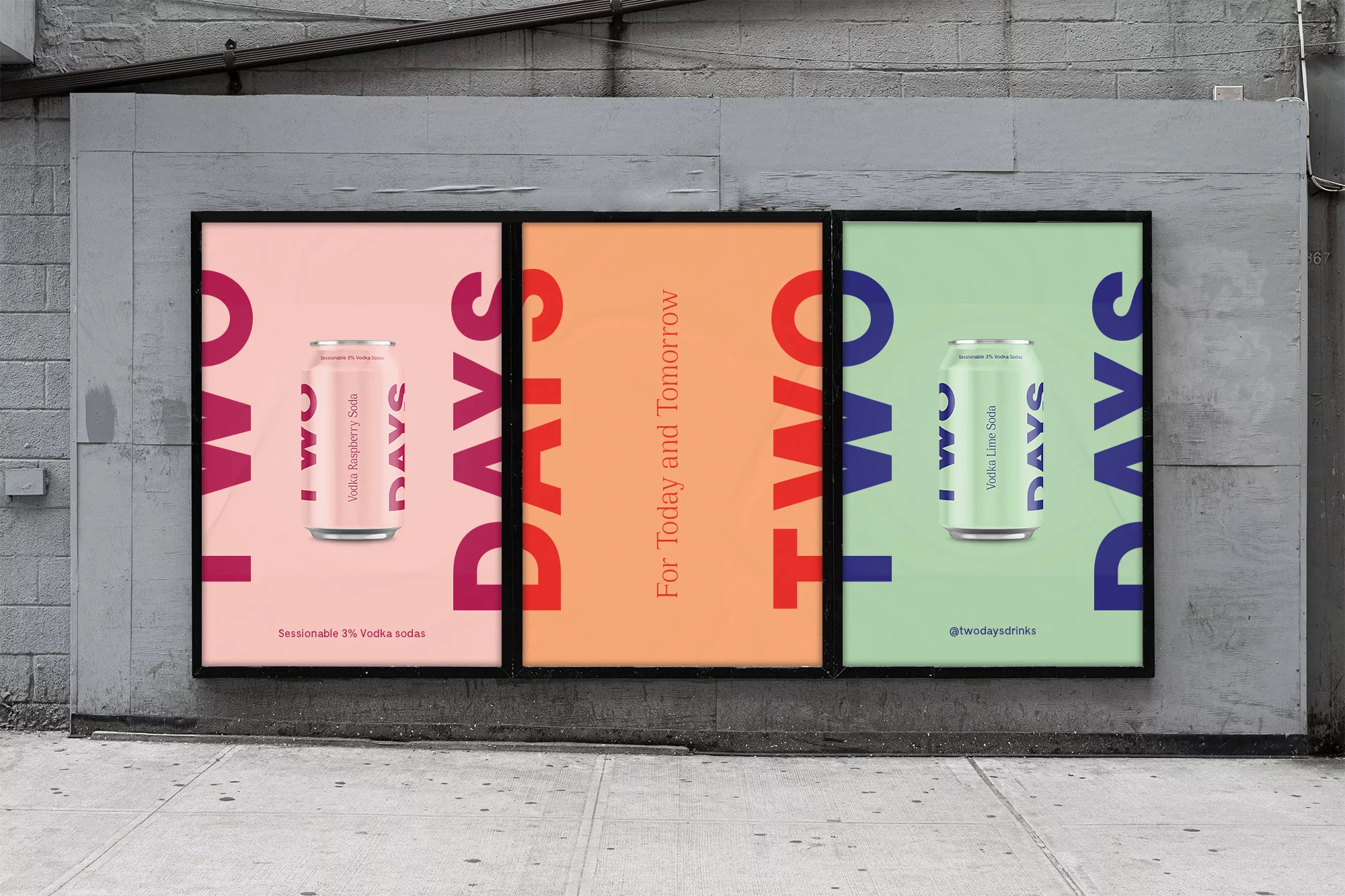 Outdoor advertisement featuring soda cans with 'Two Days' text, set against an urban gray wall, promoting a refreshing beverage brand.