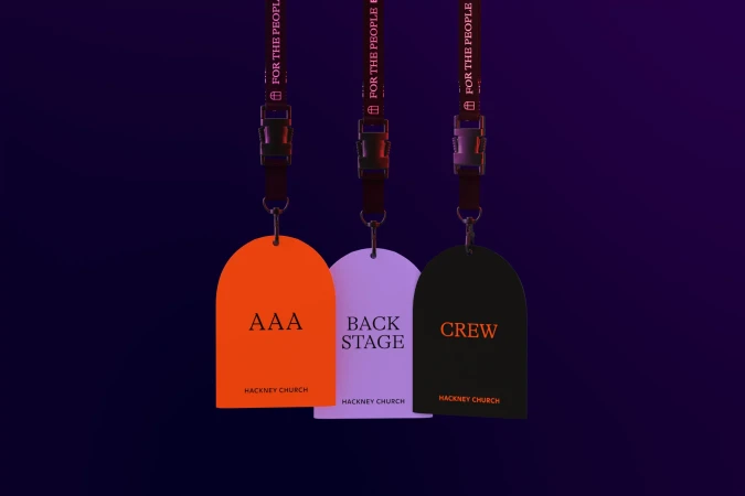 Three arched passes with lanyards displaying 'AAA,' 'Back Stage,' and 'Crew' against a dark purple gradient background, illuminated with soft lighting.