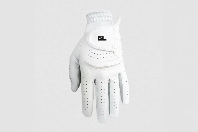 Close-up of a white golf glove featuring ventilation holes and a black logo, set against a neutral background, ideal for sports-related visuals.