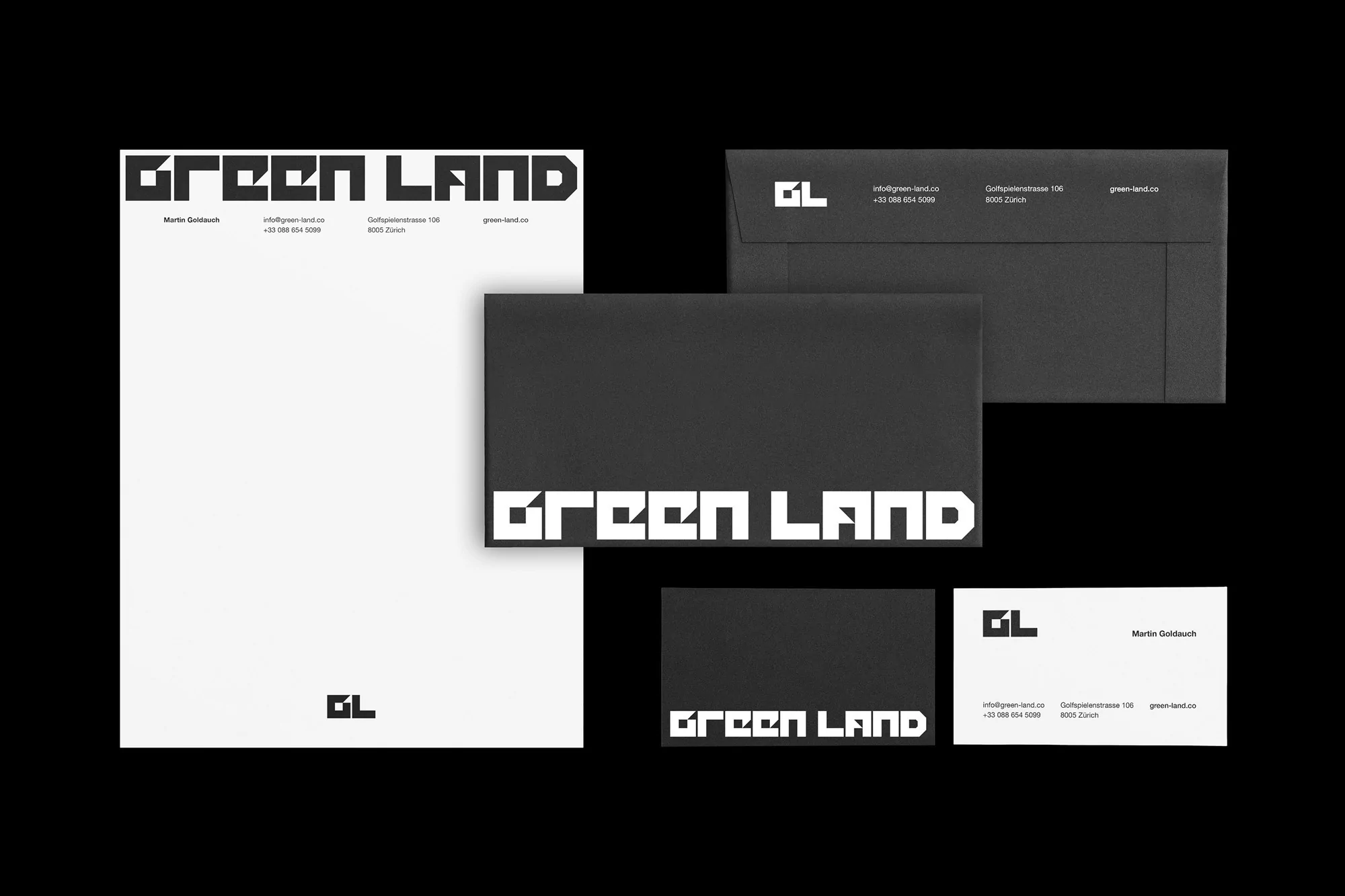 Black and white stationery set including letterhead, envelopes, and business cards with modern sans-serif branding on a black background.