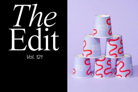 A stacked pyramid of paper cups with purple and red wavy branding against a pale purple background with black graphic text on the left.