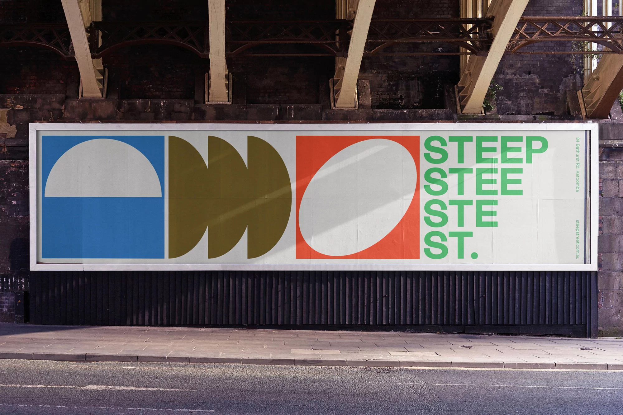 Outdoor advertising billboard featuring geometric shapes and the repeated word 'STEEP' in green lettering.