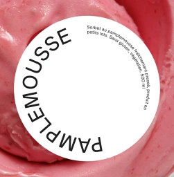 Close-up of pink grapefruit sorbet with a round white label reading PAMPLEMOUSSE for SWIRL brand identity.