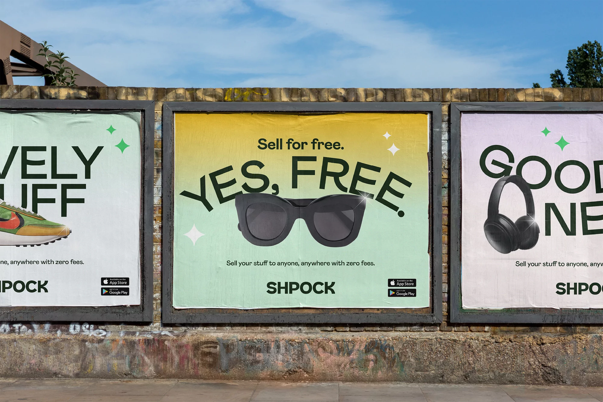 Outdoor shot of three posters on a brick wall advertising Shpock, featuring sunglasses, headphones, and a shoe with taglines.