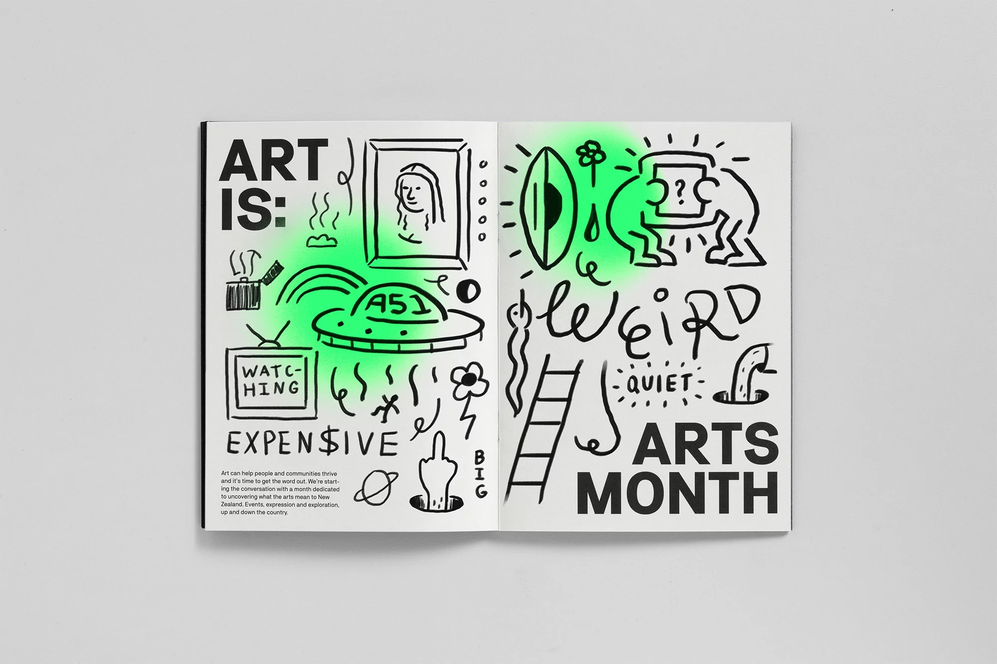 Open book spread featuring black and white doodle-style illustration with artistic theme, illuminated with a green light effect.
