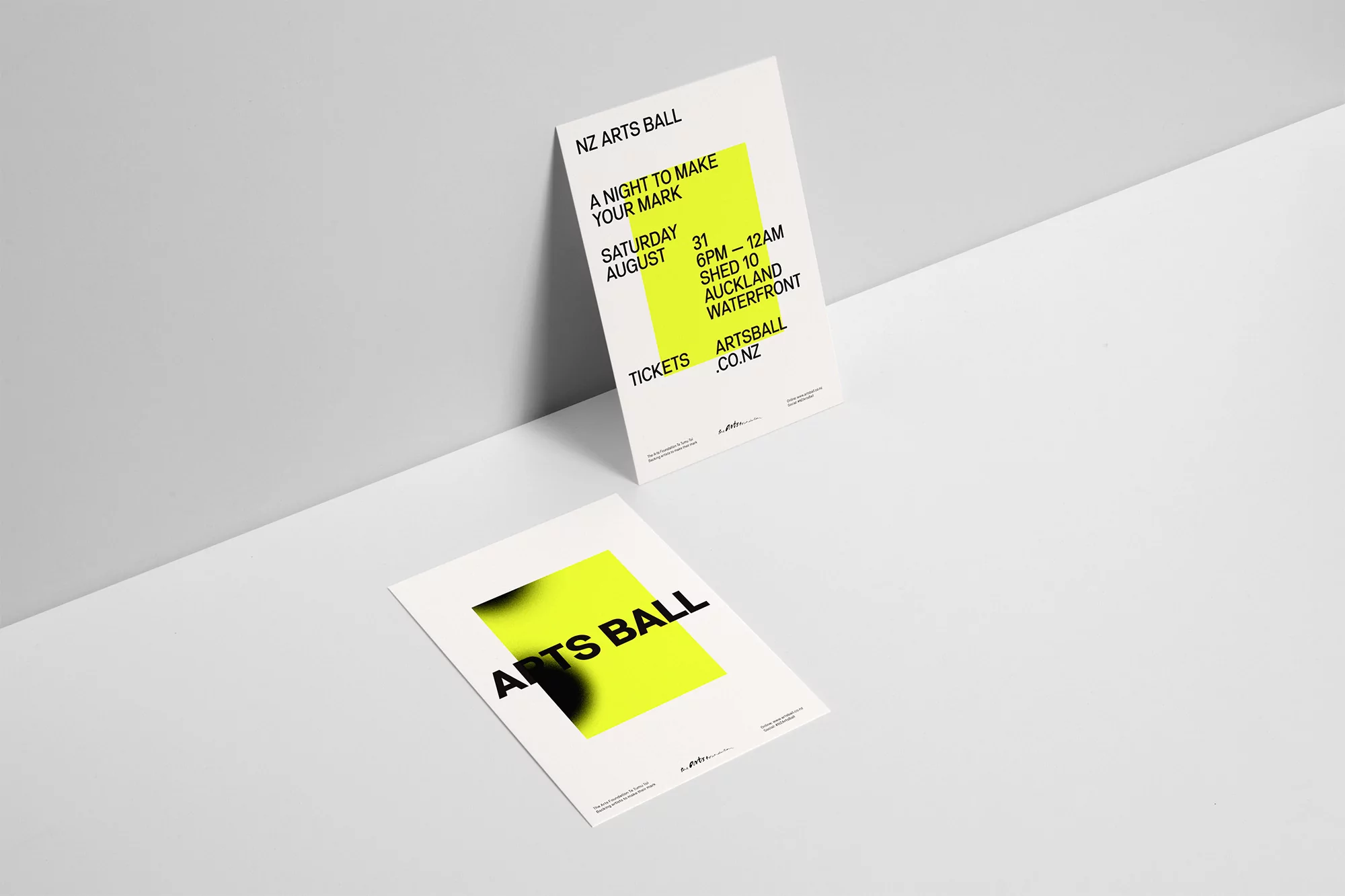 Two arts ball posters, one upright and one laying flat, featuring a neon green graphic element and event details on a clean white background.
