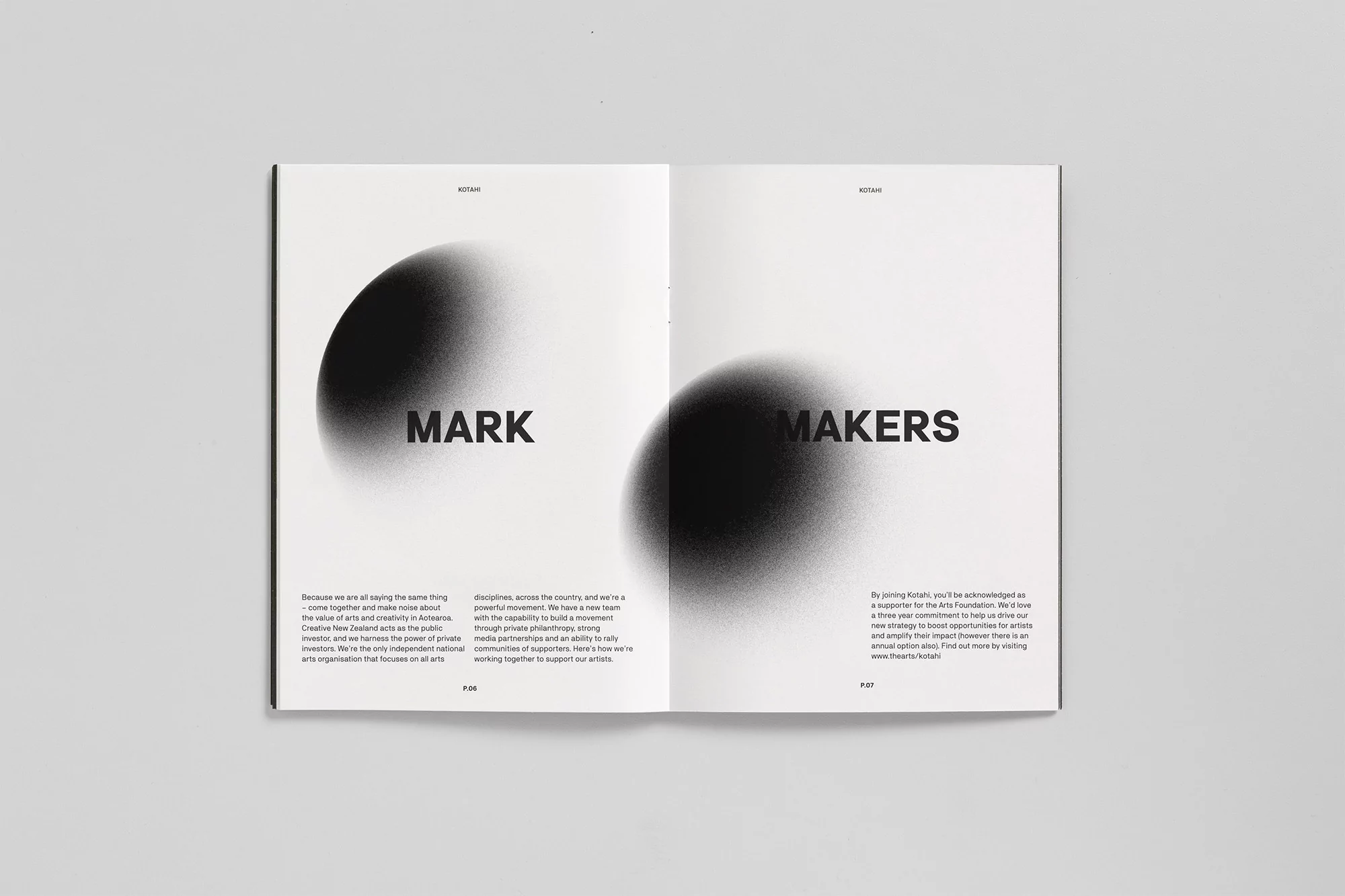 Open magazine spread featuring abstract black circle art, bold typography spelling 'MARK' and 'MAKERS' on a clean white background.