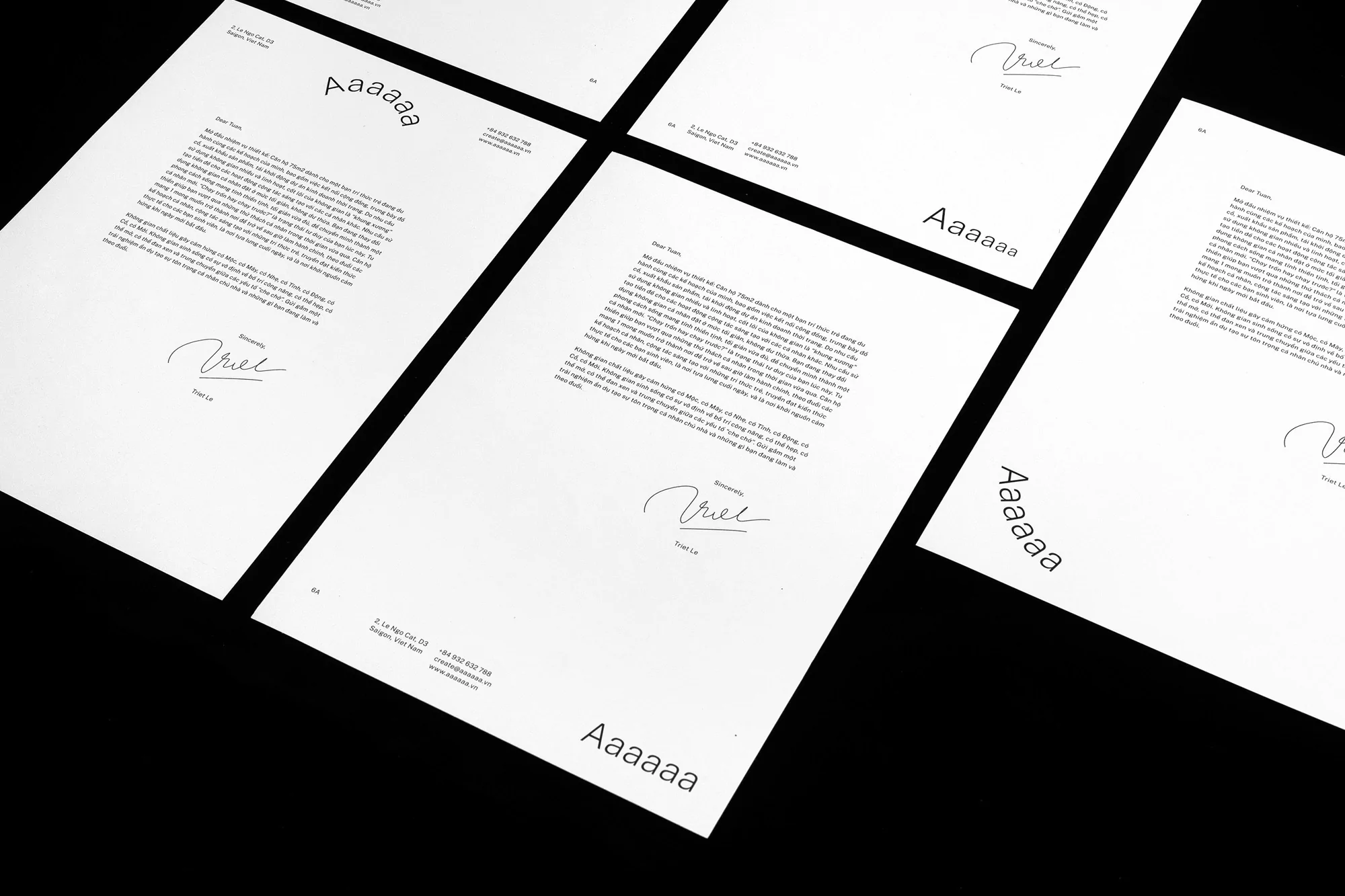 Several letterhead designs are displayed on a black background, showcasing a minimalist design with typography and signature.