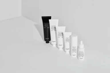 An arrangement of Jorgobé skincare tubes and bottles lined up diagonally against a plain white studio background.