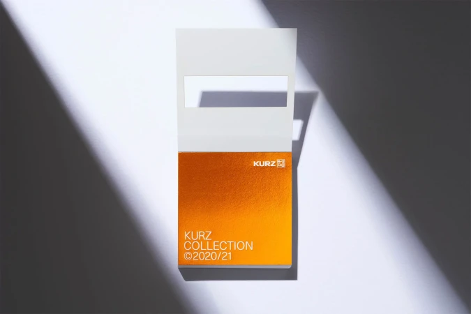 Elegant presentation of the KURZ Collection (c)2020/21 displayed on a white surface with bright studio lighting and geometric shadows.