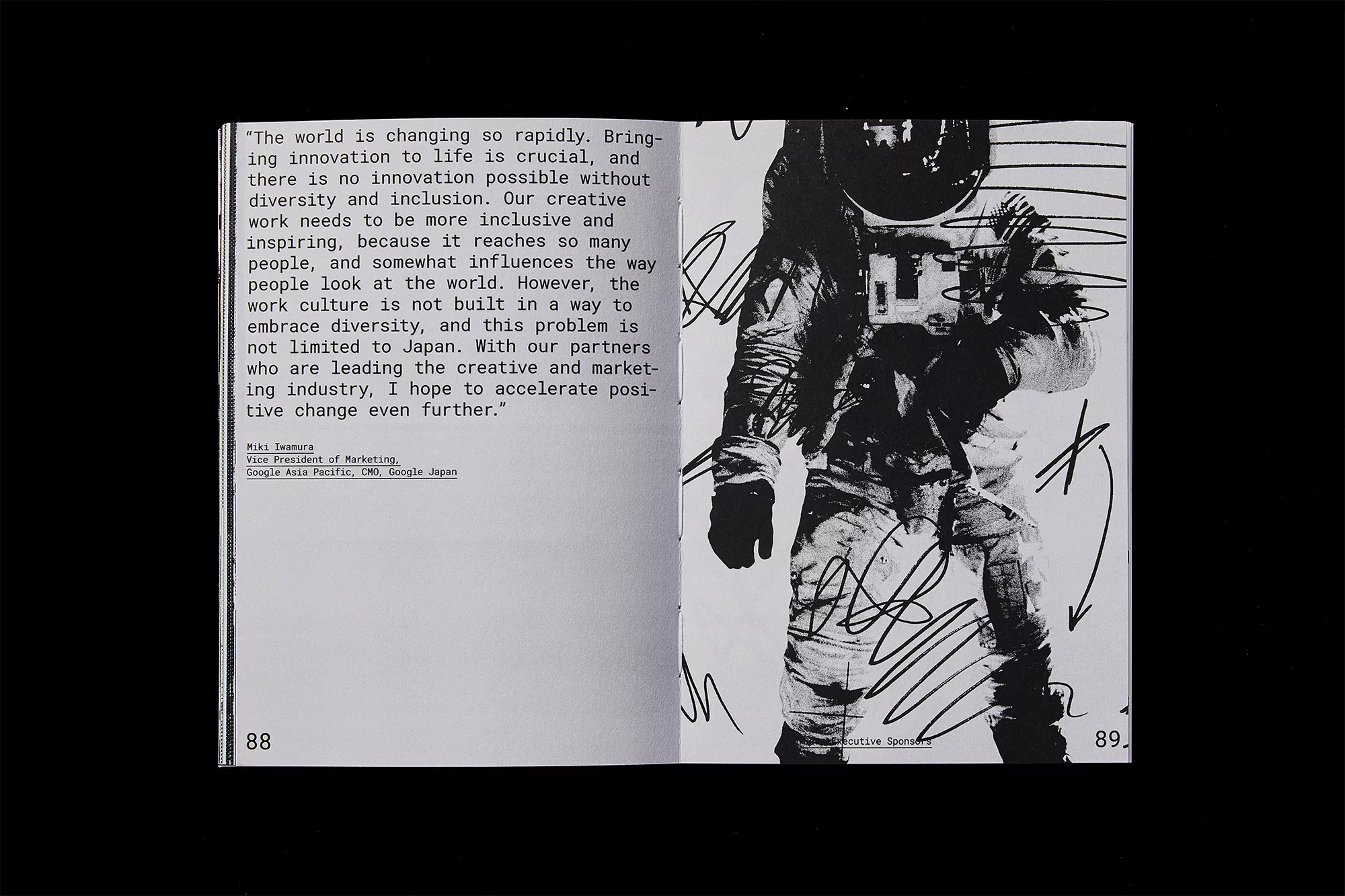 Open book pages showcase an astronaut illustration in black and white, with surrounding text on creativity and innovation.