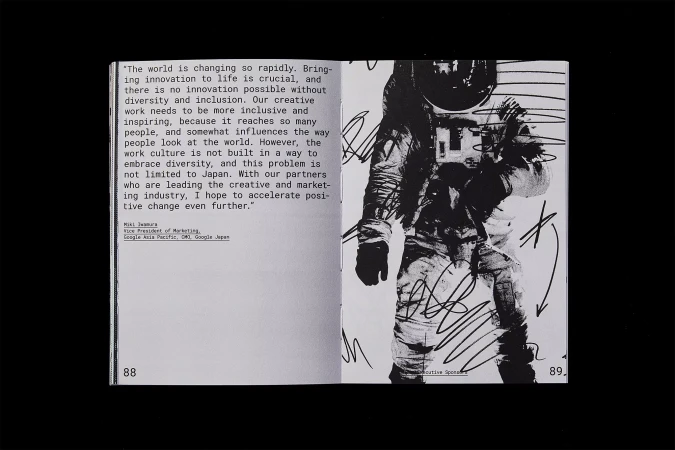 Open book pages showcase an astronaut illustration in black and white, with surrounding text on creativity and innovation.