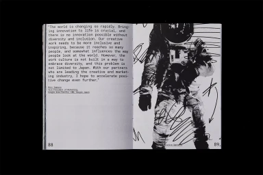 Open book spread featuring a black and white astronaut portrait with handwritten marker scribbles and quoted text on the left page.