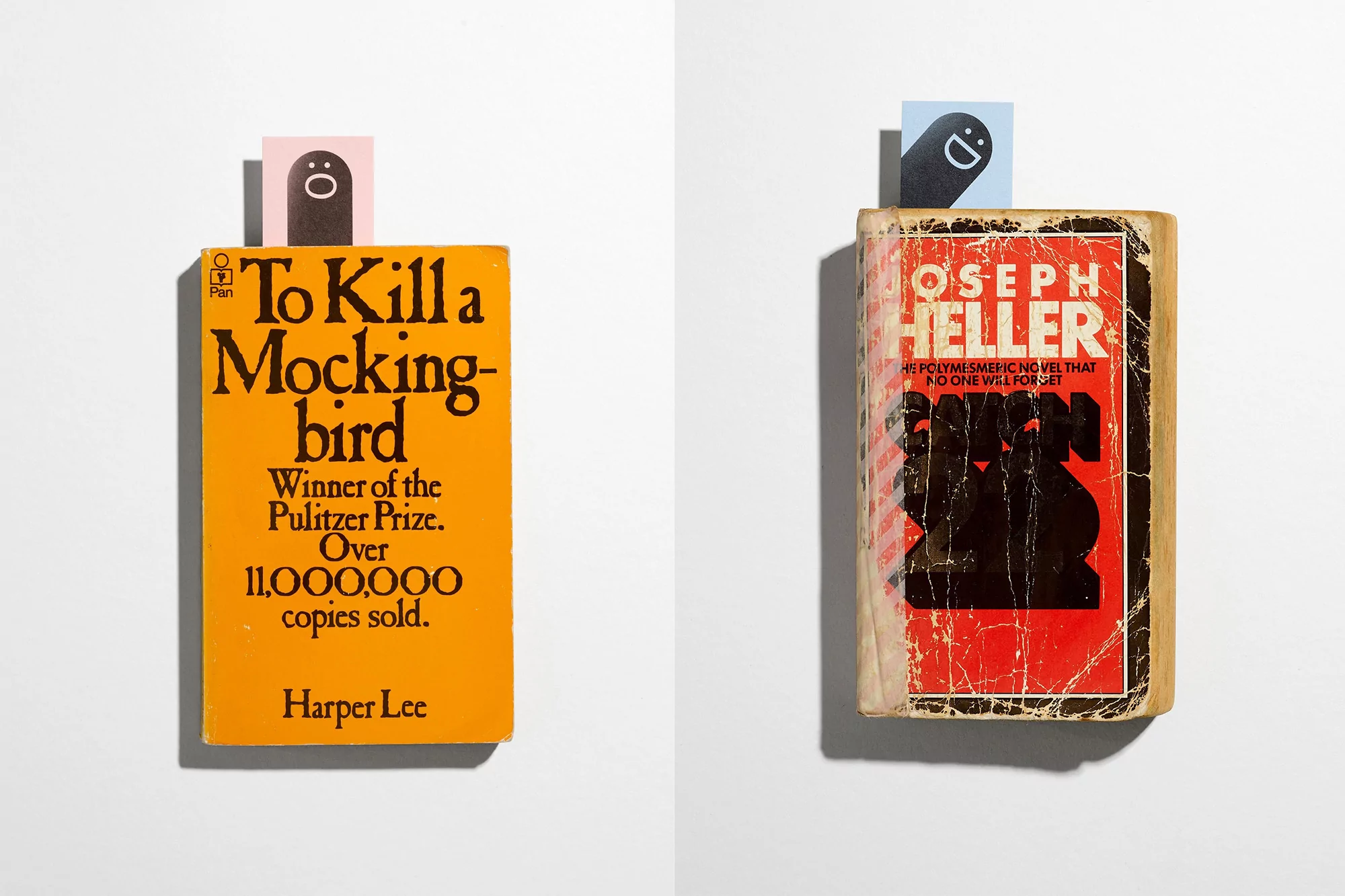 Two vintage book covers displayed on a white surface. One cover is orange with the title "To Kill a Mockingbird." 